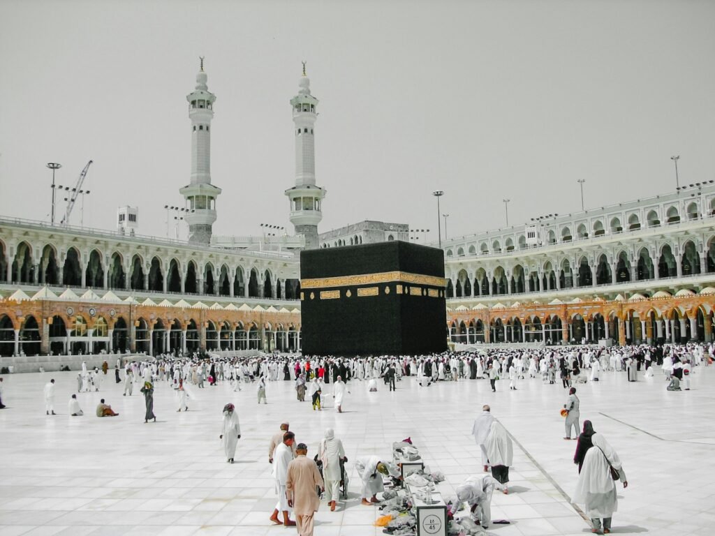 Kaaba at Masjid al-Haram, Makkah, with pilgrims in the courtyard